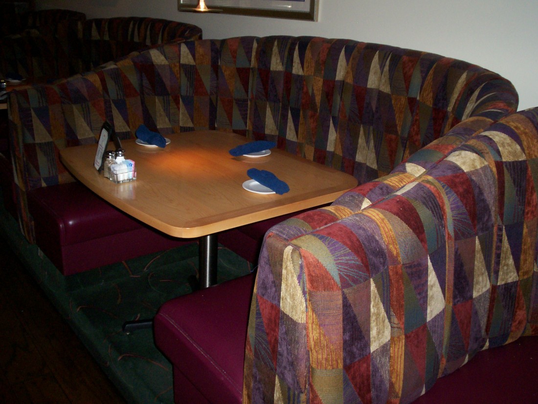 Wood Table With Booth Surrounding In Restaurant